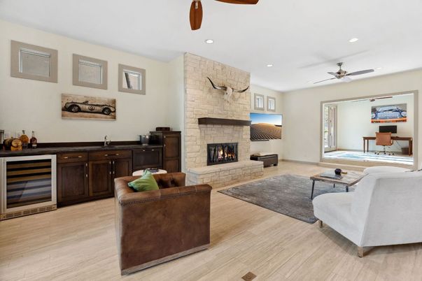 Fireplace, Interior, Living room, Recessed Lighting, Stone Walls, Wood Texture Flooring
