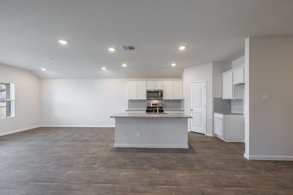 Empty room, Interior, Kitchen, Recessed Lighting, Stainless Steel Appliances, Wood Texture Flooring