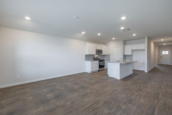 Empty room, Interior, Kitchen, Recessed Lighting, Stainless Steel Appliances, Wood Texture Flooring