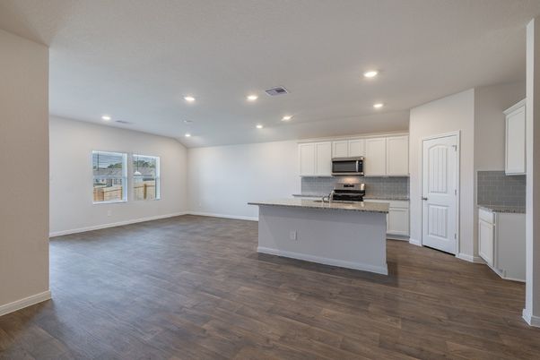Empty room, Interior, Kitchen, Recessed Lighting, Stainless Steel Appliances, Wood Texture Flooring