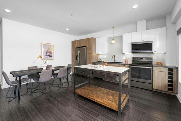 Dining room, Interior, Kitchen, Pendant Lights, Recessed Lighting, Stainless Steel Appliances, Wood Texture Flooring