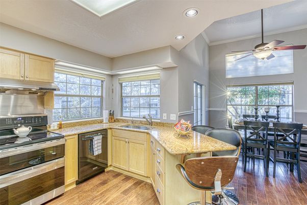 Dining room, Interior, Kitchen, Recessed Lighting, Stainless Steel Appliances, Wood Texture Flooring