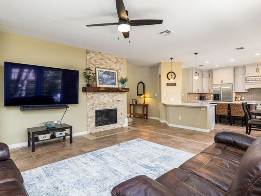 Fireplace, Interior, Kitchen, Pendant Lights, Recessed Lighting, Stainless Steel Appliances, Stone Walls, Wood Texture Flooring