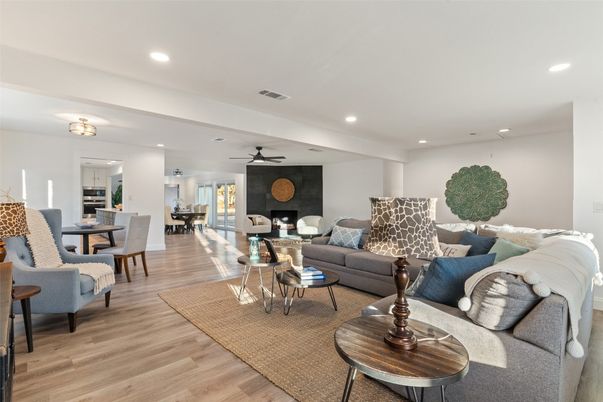 Dining room, Fireplace, Interior, Living room, Recessed Lighting, Wood Texture Flooring