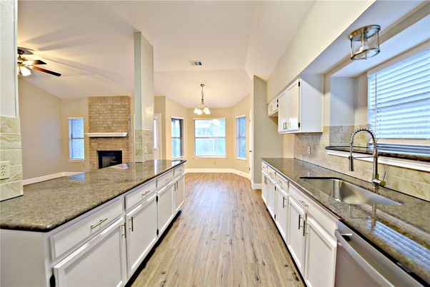 Fireplace, Interior, Kitchen, Pendant Lights, Stone Walls, Wood Texture Flooring