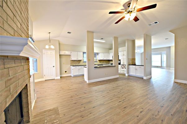Empty room, Fireplace, Interior, Kitchen, Pendant Lights, Stone Walls, Wood Texture Flooring