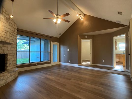 Empty room, Fireplace, Interior, Pendant Lights, Stone Walls, Wood Texture Flooring