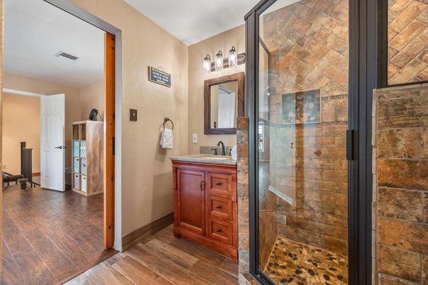 Bathroom, Glass Shower, Interior, Stone Walls, Wood Texture Flooring