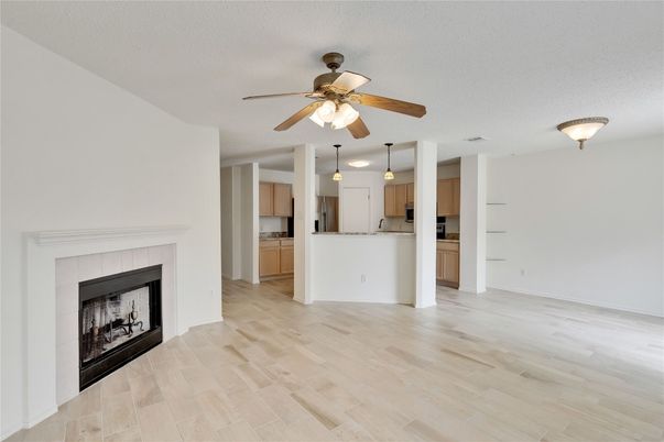 Empty room, Fireplace, Interior, Kitchen, Pendant Lights, Wood Texture Flooring