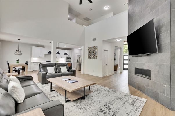 Dining room, Fireplace, Interior, Kitchen, Living room, Pendant Lights, Recessed Lighting, Stainless Steel Appliances, Wood Texture Flooring