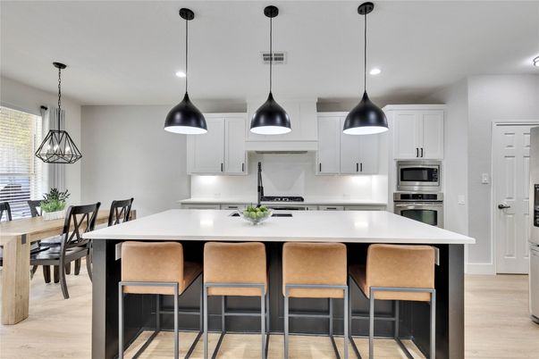Dining room, Interior, Kitchen, Pendant Lights, Recessed Lighting, Stainless Steel Appliances, Wood Texture Flooring