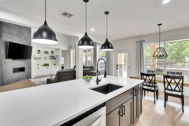 Dining room, Fireplace, Interior, Kitchen, Living room, Pendant Lights, Recessed Lighting, Stainless Steel Appliances, Wood Texture Flooring