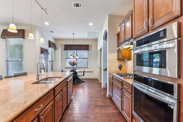 Dining room, Interior, Kitchen, Pendant Lights, Recessed Lighting, Stainless Steel Appliances, Wood Texture Flooring