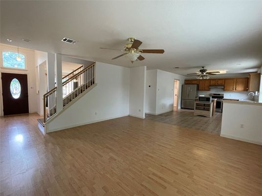Empty room, Interior, Kitchen, Pendant Lights, Recessed Lighting, Stainless Steel Appliances, Wood Texture Flooring
