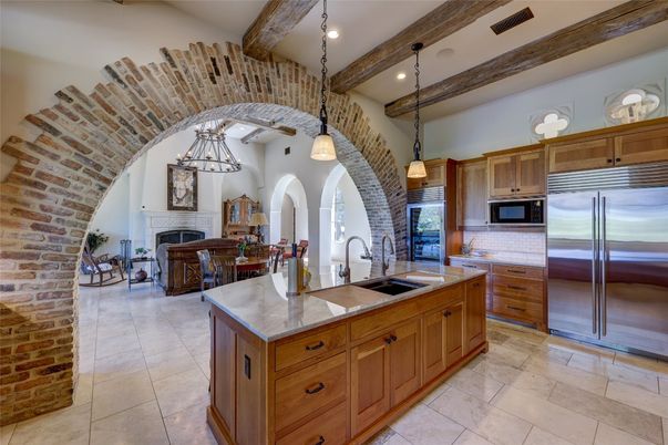 Dining room, Fireplace, Interior, Kitchen, Pendant Lights, Recessed Lighting, Stainless Steel Appliances, Stone Walls, Wooden Beams