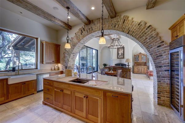 Fireplace, Interior, Kitchen, Pendant Lights, Recessed Lighting, Stainless Steel Appliances, Stone Walls, Wooden Beams