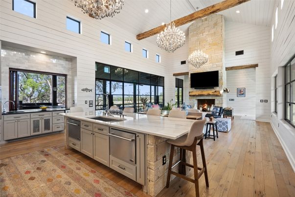 Chandelier, Fireplace, Interior, Kitchen, Living room, Recessed Lighting, Stainless Steel Appliances, Wooden Beams, Wood Texture Flooring
