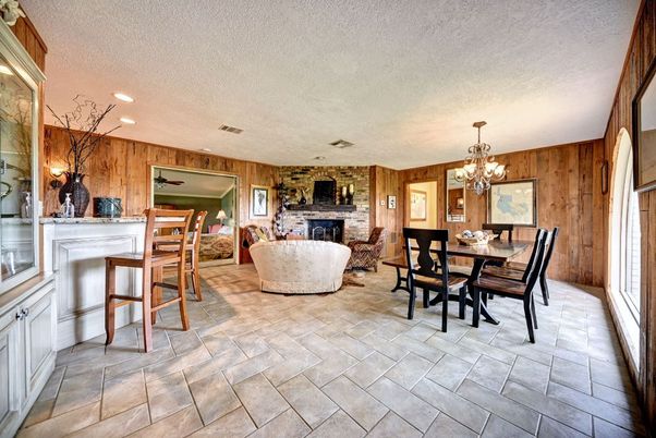 Chandelier, Dining room, Fireplace, Interior, Living room, Recessed Lighting, Stone Walls, Wooden Walls