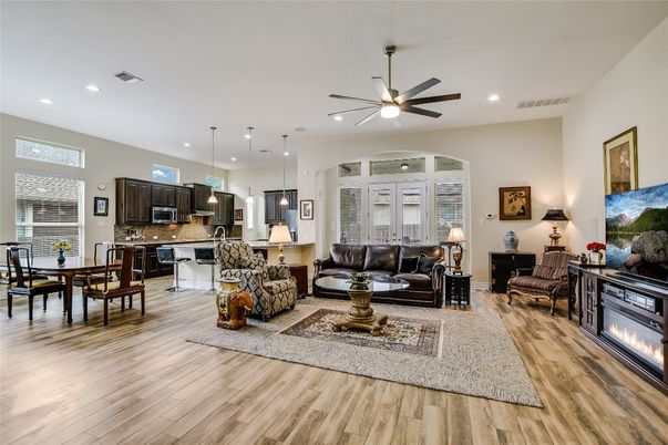 Dining room, Fireplace, Interior, Kitchen, Living room, Pendant Lights, Recessed Lighting, Stainless Steel Appliances, Wood Texture Flooring