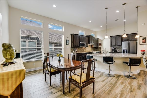 Dining room, Interior, Kitchen, Pendant Lights, Recessed Lighting, Stainless Steel Appliances, Wood Texture Flooring
