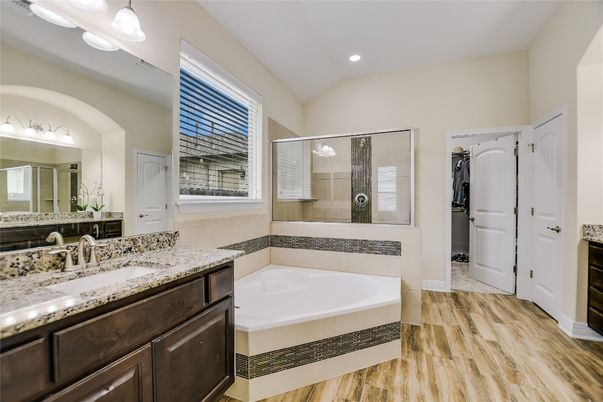 Bathroom, Dual Sink Vanities, Glass Shower, Interior, Recessed Lighting, Wood Texture Flooring