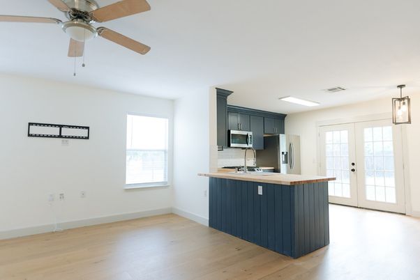 Empty room, Interior, Kitchen, Pendant Lights, Stainless Steel Appliances, Wood Texture Flooring