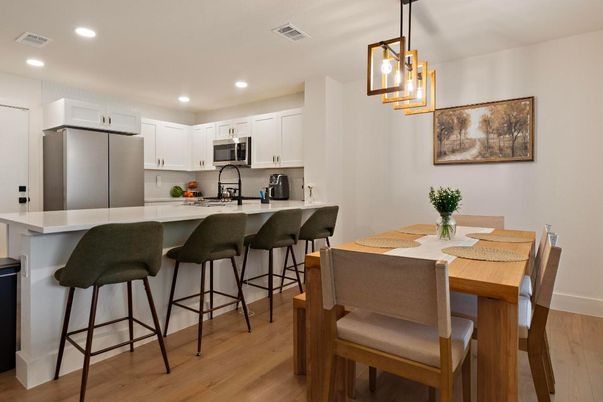 Dining room, Interior, Kitchen, Pendant Lights, Recessed Lighting, Stainless Steel Appliances, Wood Texture Flooring