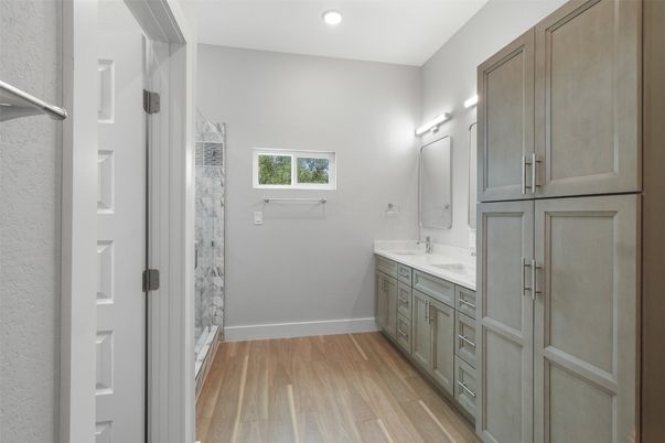 Bathroom, Dual Sink Vanities, Interior, Recessed Lighting, Wood Texture Flooring