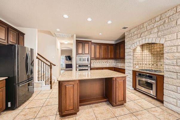 Interior, Kitchen, Recessed Lighting, Stainless Steel Appliances, Stone Walls