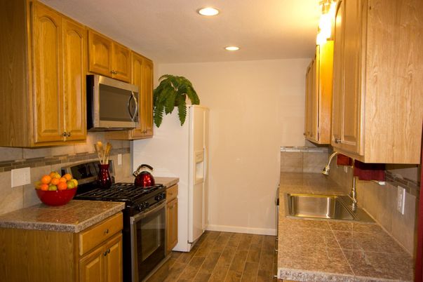 Interior, Kitchen, Recessed Lighting, Tile Countertops, Wood Texture Flooring