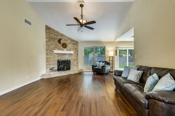 Fireplace, Interior, Living room, Recessed Lighting, Stone Walls, Wood Texture Flooring