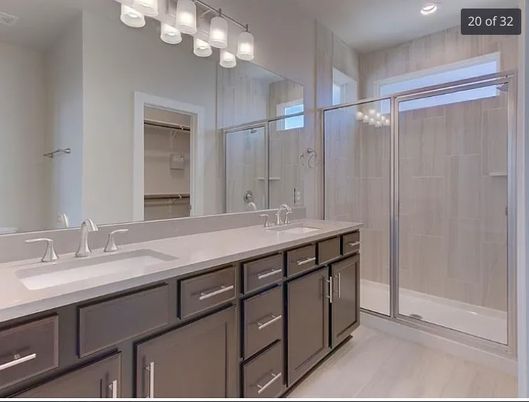 Bathroom, Dual Sink Vanities, Glass Shower, Interior, Recessed Lighting, Wood Texture Flooring