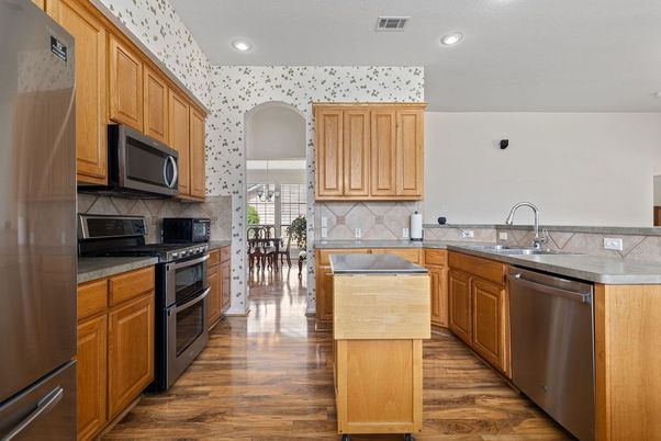 Dining room, Interior, Kitchen, Recessed Lighting, Stainless Steel Appliances, Wood Texture Flooring