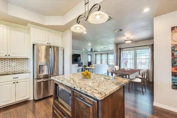 Dining room, Interior, Kitchen, Pendant Lights, Recessed Lighting, Stainless Steel Appliances, Wood Texture Flooring