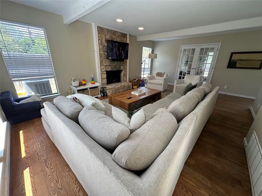 Fireplace, Interior, Living room, Recessed Lighting, Stone Walls, Wood Texture Flooring