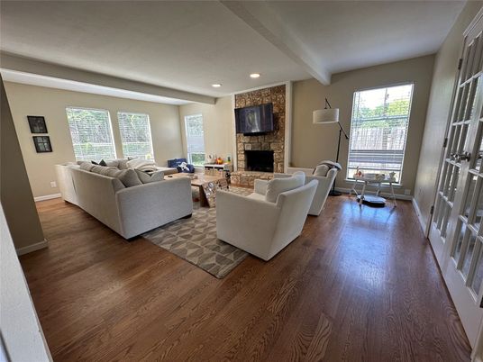 Fireplace, Interior, Living room, Recessed Lighting, Stone Walls, Wood Texture Flooring