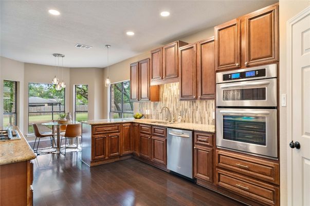 Dining room, Interior, Kitchen, Pendant Lights, Recessed Lighting, Stainless Steel Appliances, Wood Texture Flooring