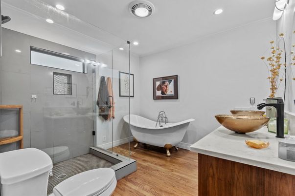 Bathroom, Free Standing Baths, Glass Shower, Interior, Recessed Lighting, Wood Texture Flooring