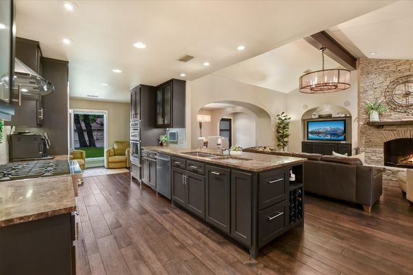 Chandelier, Fireplace, Interior, Kitchen, Living room, Pendant Lights, Recessed Lighting, Stone Walls, Wood Texture Flooring