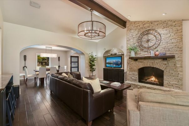 Chandelier, Dining room, Fireplace, Interior, Living room, Pendant Lights, Recessed Lighting, Stone Walls, Wooden Beams, Wood Texture Flooring