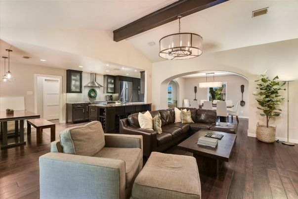 Chandelier, Dining room, Interior, Kitchen, Living room, Pendant Lights, Recessed Lighting, Stainless Steel Appliances, Wooden Beams, Wood Texture Flooring