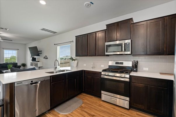 Interior, Kitchen, Recessed Lighting, Stainless Steel Appliances, Wood Texture Flooring