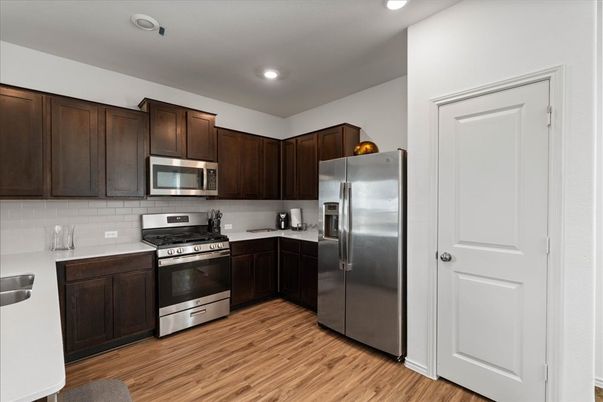Interior, Kitchen, Recessed Lighting, Stainless Steel Appliances, Wood Texture Flooring