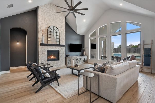 Fireplace, Interior, Living room, Recessed Lighting, Stone Walls, Wood Texture Flooring