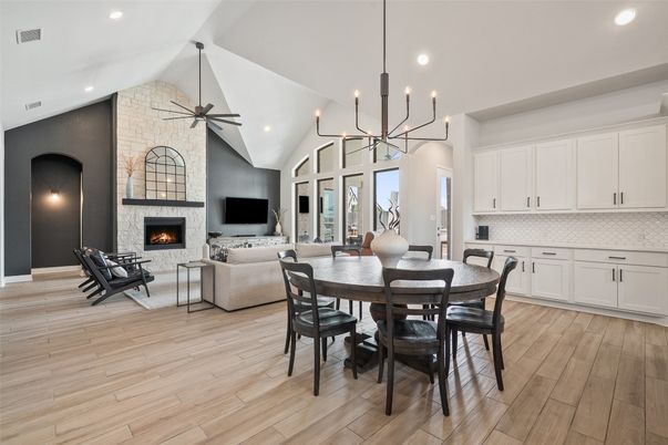 Dining room, Fireplace, Interior, Living room, Pendant Lights, Recessed Lighting, Stone Walls, Wood Texture Flooring