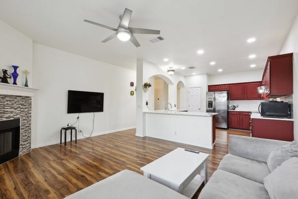 Fireplace, Interior, Kitchen, Living room, Recessed Lighting, Stainless Steel Appliances, Wood Texture Flooring