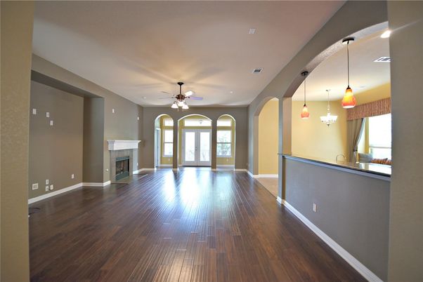 Empty room, Fireplace, Interior, Pendant Lights, Recessed Lighting, Wood Texture Flooring
