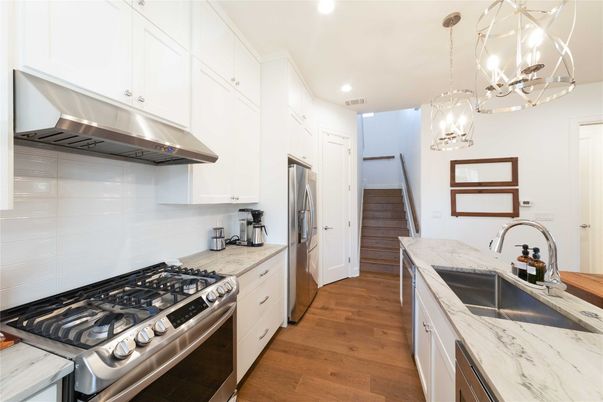 Chandelier, Interior, Kitchen, Pendant Lights, Recessed Lighting, Stainless Steel Appliances, Wood Texture Flooring