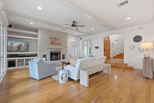 Fireplace, Interior, Living room, Recessed Lighting, Stone Walls, Wood Texture Flooring