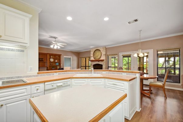 Dining room, Fireplace, Interior, Kitchen, Pendant Lights, Recessed Lighting, Wood Texture Flooring